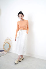 Peach knit boat neckline top