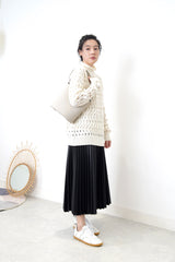 Ivory sweater in wavy crochet pattern