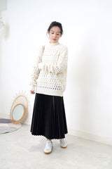 Ivory sweater in wavy crochet pattern