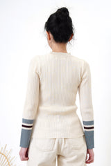 Beige knit top w/ contrast color sleeves
