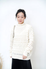 Ivory sweater in wavy crochet pattern
