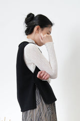 Black wool vest in side vents