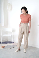 Beige checked trousers in waist detail