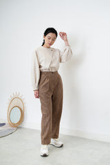 Nude satin blouse in asymmetrical cutting