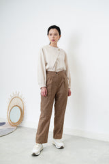 Nude satin blouse in asymmetrical cutting