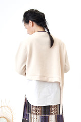 Cream crop pullover in shirt layering