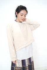 Cream crop pullover in shirt layering