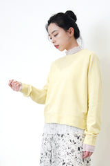 Pastel yellow pullover in crop cut