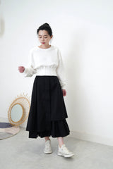 White pullover in corset hem