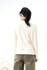 Cream funnel neck top in contrast trimmed