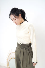 Cream funnel neck top in contrast trimmed