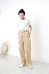 Beige trousers in detail waist strap