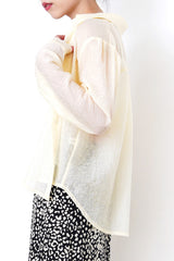 Pastel yellow sheer shirt in texture detail