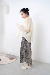 Pastel yellow sheer shirt in texture detail