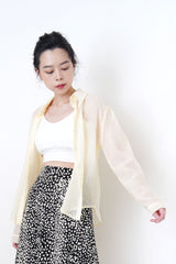 Pastel yellow sheer shirt in texture detail