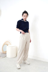 Light grey trousers in flip hem