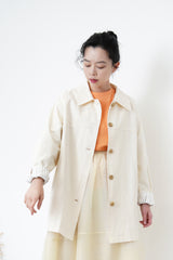 Cream trench coat w/ contrast sleeves