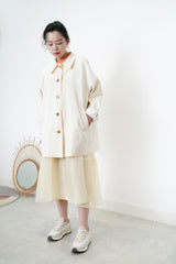 Cream trench coat w/ contrast sleeves