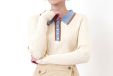 Light beige knit top w/ blue polo collar