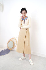 Light beige knit top w/ blue polo collar