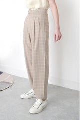 Beige checked trousers in waist detail