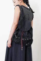 Black checked backpack w/ contrast string
