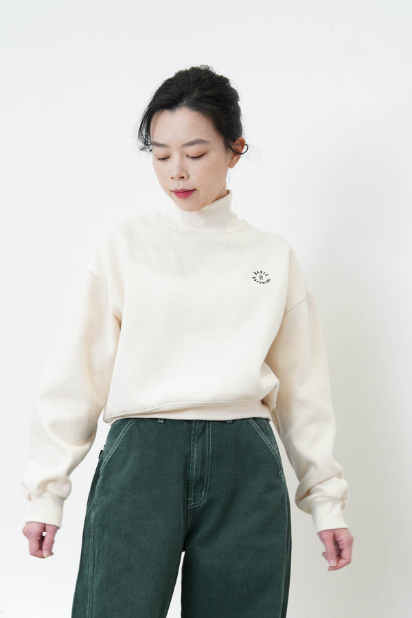 Ivory turtle neck pullover w/ embroidery