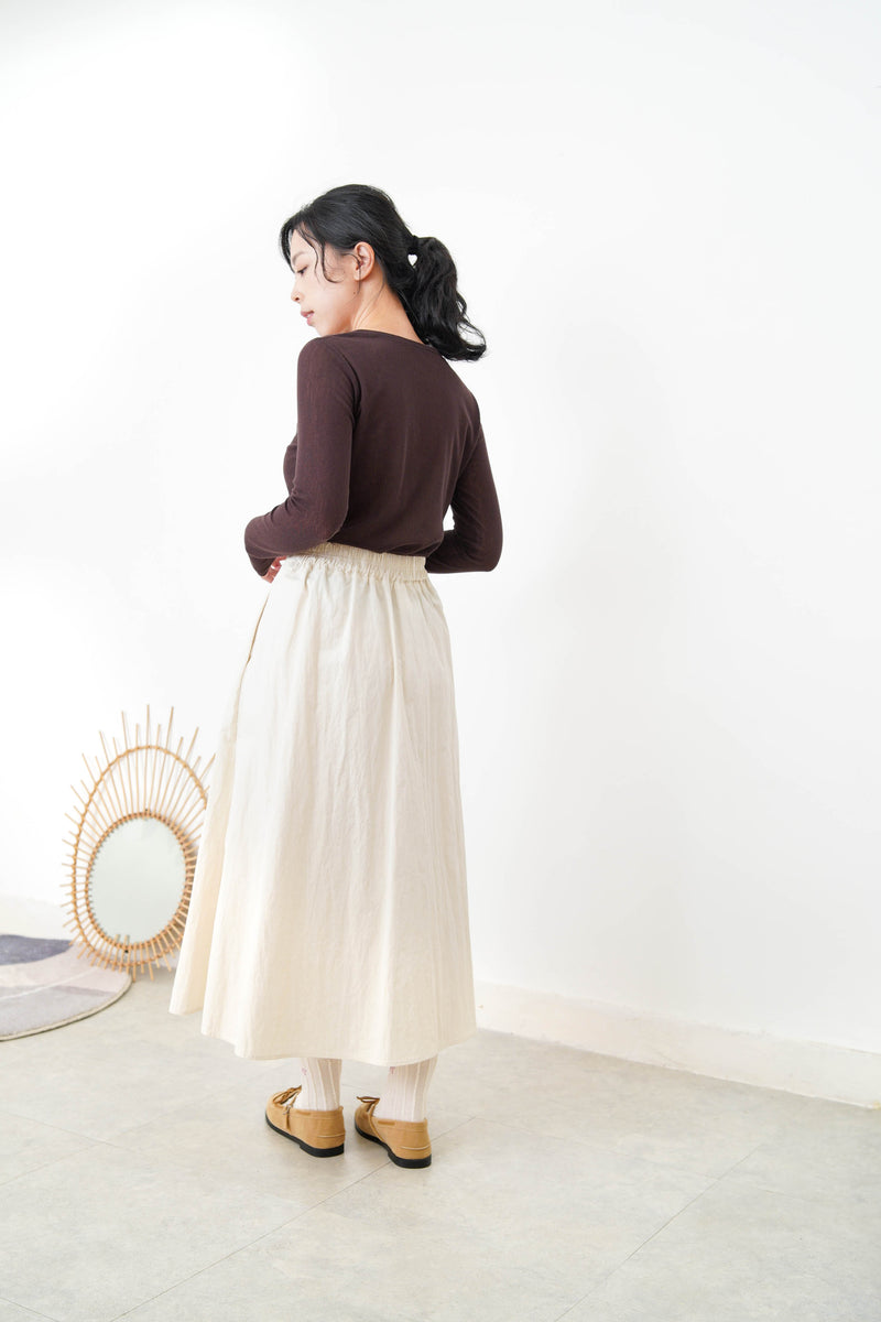 Brown button top in contrast layer