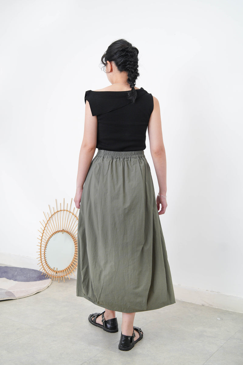 Black flipped layer vest in asy. Cut