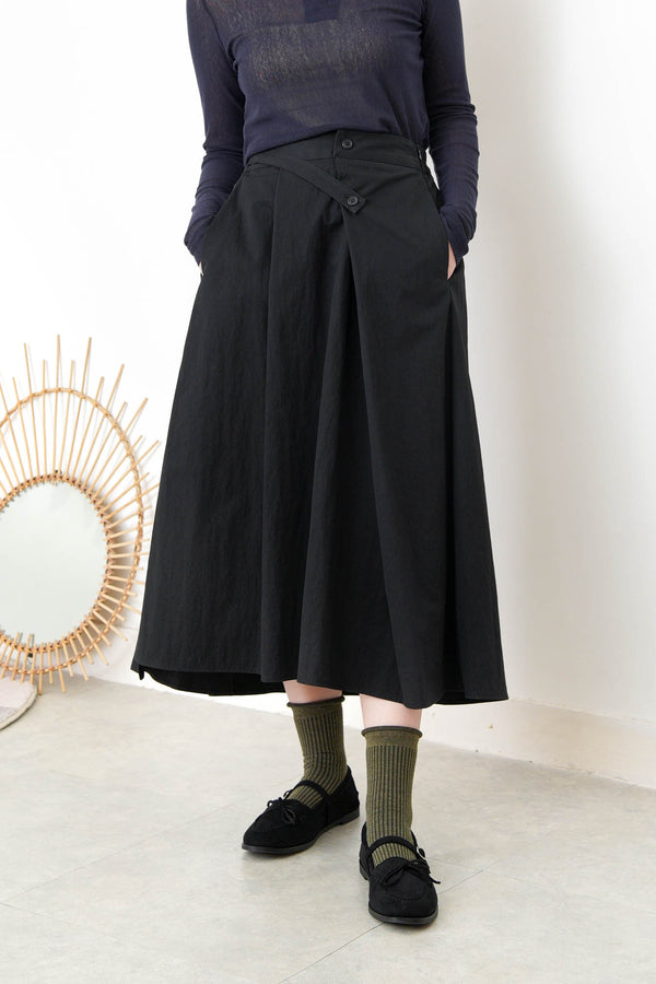 Black in a cut skirt with waist strap