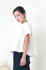 White pleats top in peplum hem