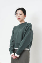 Green pullover in crop cut