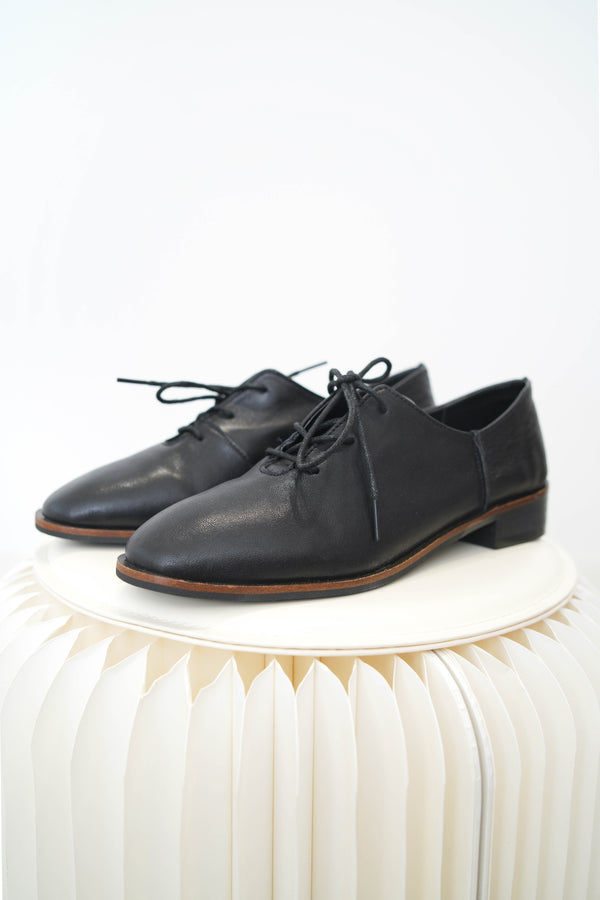 Black leather lace up shoes