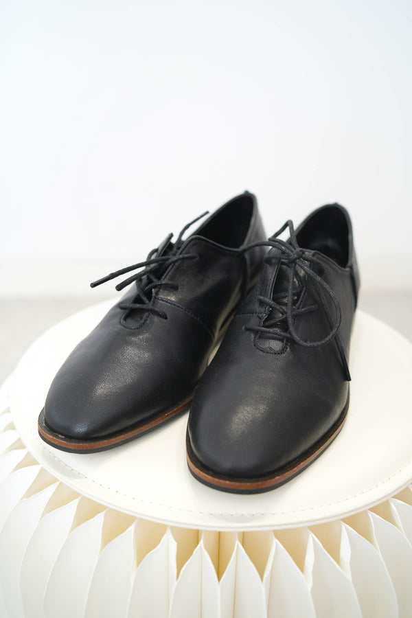 Black leather lace up shoes