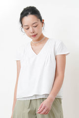White v neck shirt w/ layering hem
