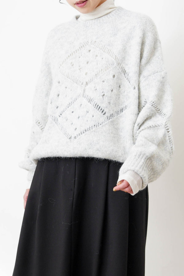 Grey sweater in crochet net details