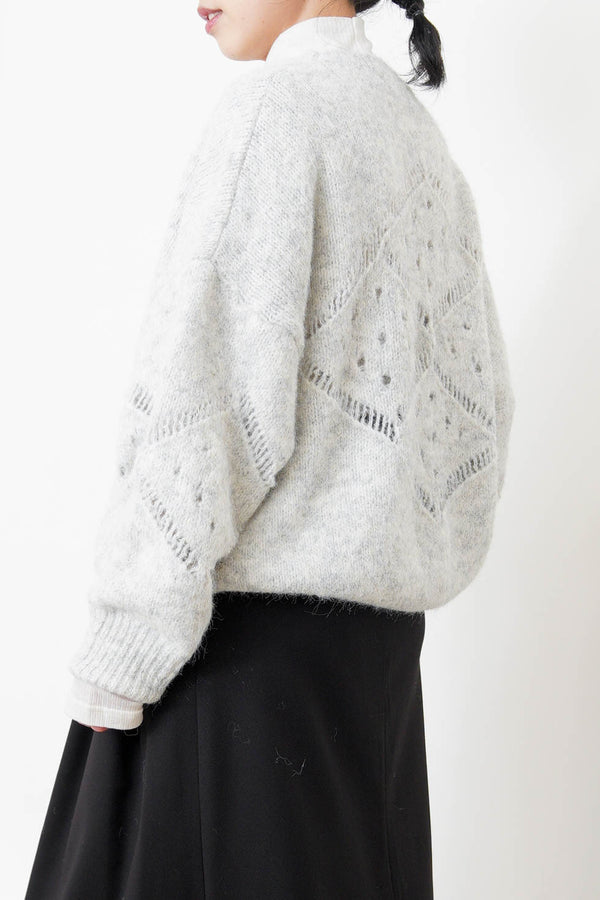 Grey sweater in crochet net details