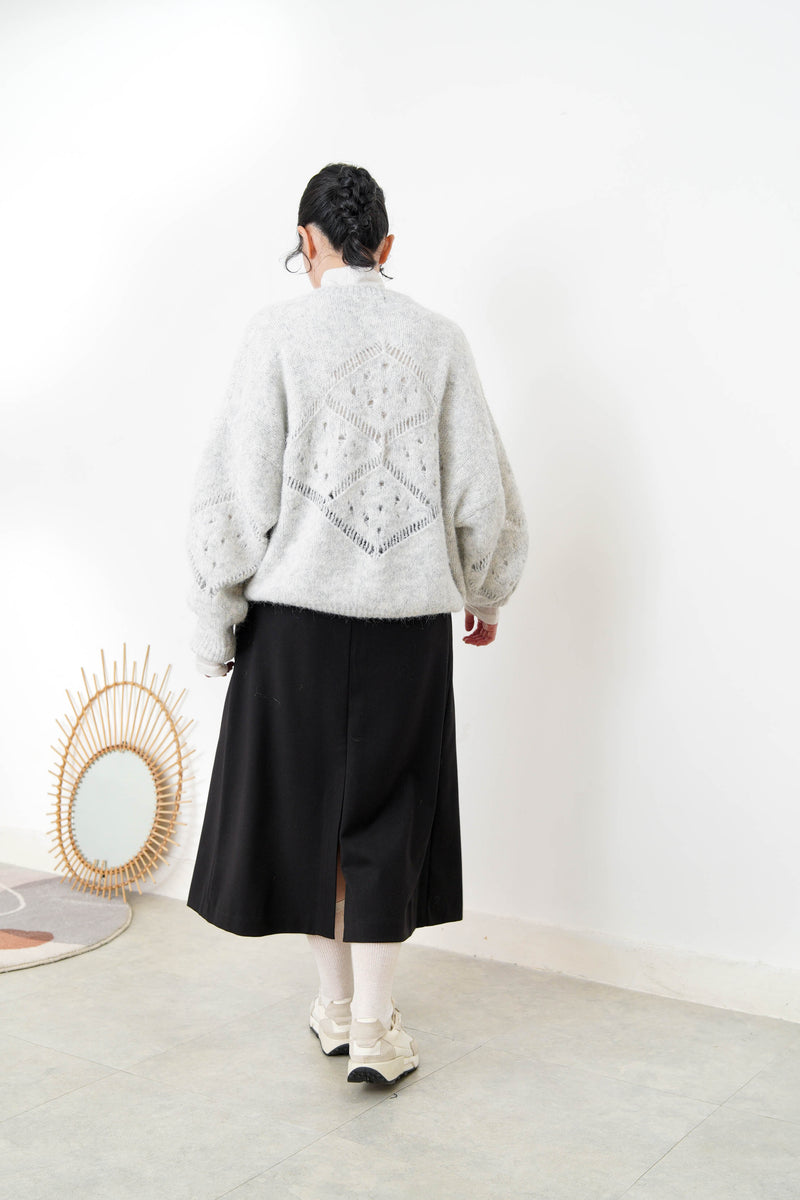 Grey sweater in crochet net details