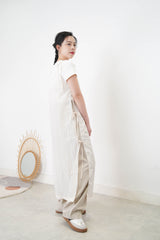 Light beige wide leg trousers w/ strings and buttons