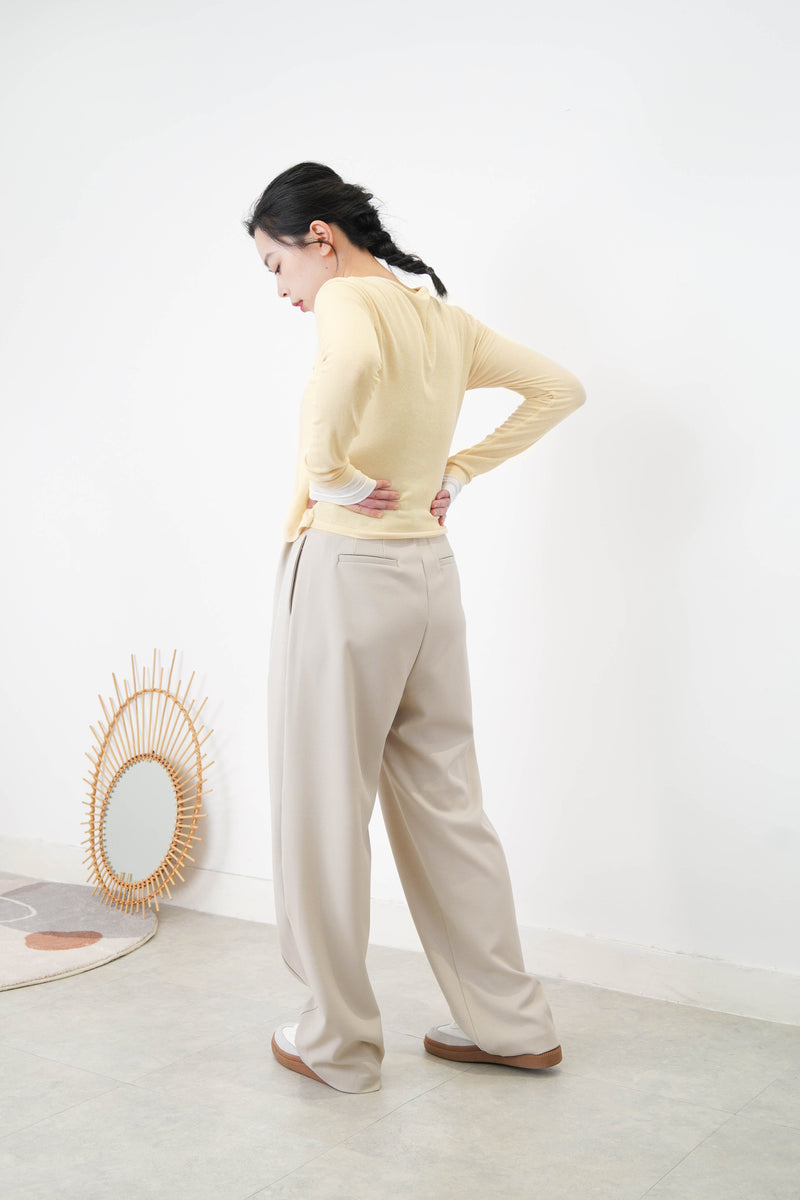 Light beige wide leg trousers w/ strings and buttons