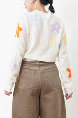 white knit top with floral pattern