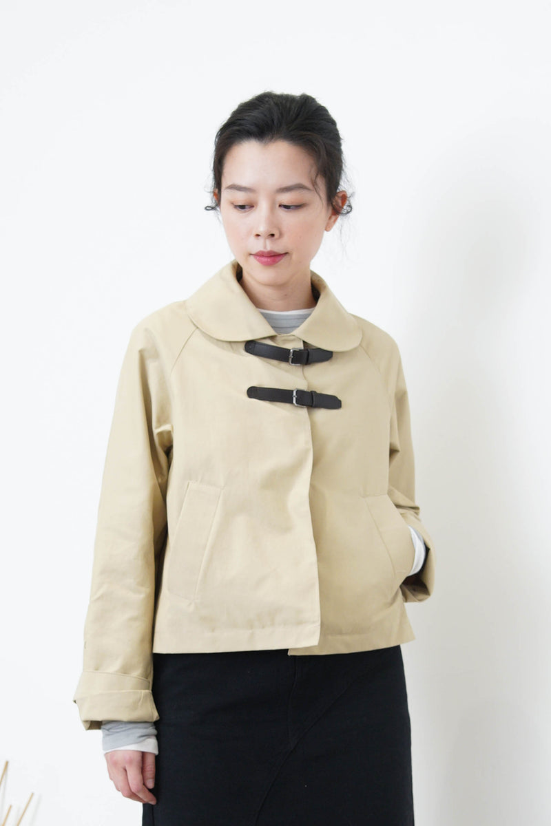 Beige short trench coat w/ buckles