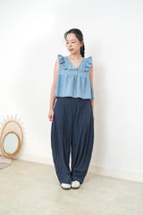 Light blue denim vest w/ ruffle shoulders