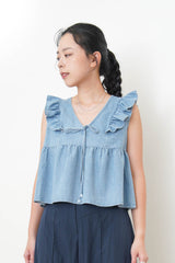 Light blue denim vest w/ ruffle shoulders