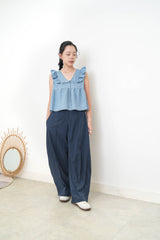 Light blue denim vest w/ ruffle shoulders
