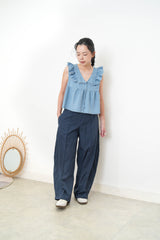 Light blue denim vest w/ ruffle shoulders