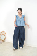 Light blue denim vest w/ ruffle shoulders