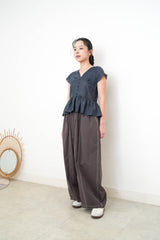 Navy V neck blouse in peplum hem