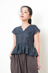 Navy V neck blouse in peplum hem