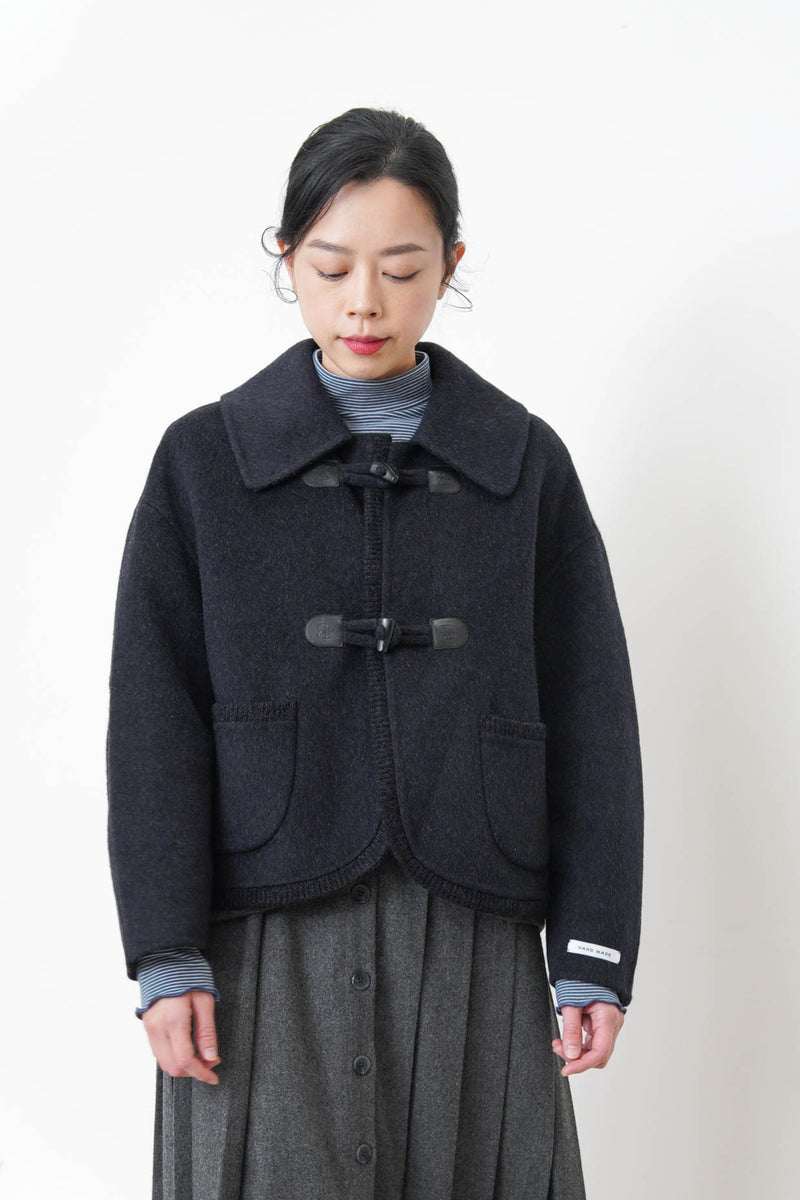 Black 90% handmade wool jacket w/ knit trimmed details